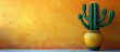 Cactus in pot on table. Textured yellow wall background with copy space.