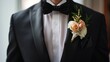 © zainab - A man in a stylish tuxedo poses with a flower in his lapel, exuding sophistication and charm