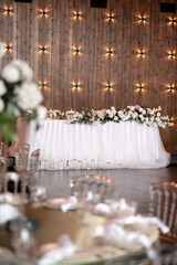 Wall Mural - Main table at a wedding reception with beautiful fresh flowers. Wedding day.