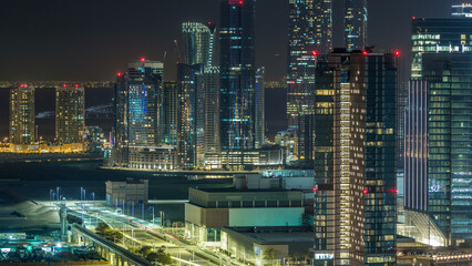 Wall Mural - Aerial skyline of Abu Dhabi city centre from above night timelapse