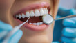 © Ayla - Close-up of dentist and patient dentistry with dental tools focusing on woman's teeth, promoting dental care, oral dentistry and health care.