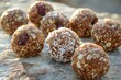 Raw energy balls crafted from dates, nuts, and coconut flakes, symbolizing Earth Day's emphasis on raw, unprocessed foods that honor the Earth's natural bounty.