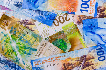 Wall Mural - Background of the one and two hundred francs banknotes. Swiss money