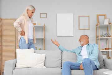 Poster - Mature couple quarreling at home. Divorce concept