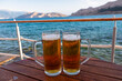 © Chris - Drinking beer at a beach bar in idyllic coastal town Baska, Krk Island, Primorje-Gorski Kotar, Croatia, Europe. Majestic coastline of Mediterranean Adriatic in summer. Vacation in tropical paradise