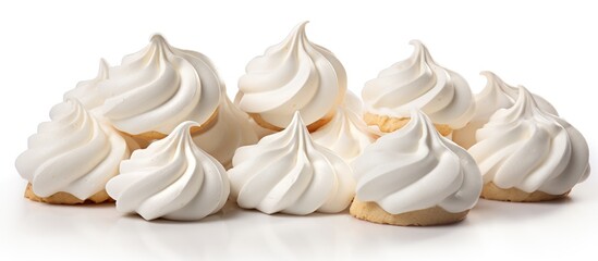 Wall Mural - A line of white meringue cookies is beautifully displayed on a white platter, creating a lovely contrast. This elegant and light dessert is perfect for any occasion