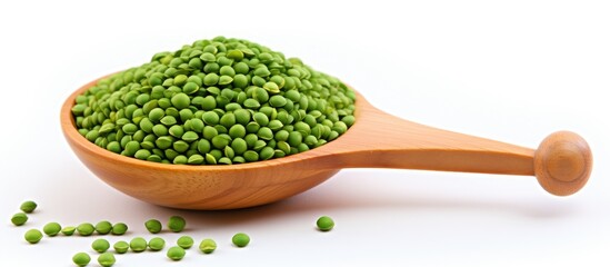 Poster - A wooden spoon filled with green peas, a legume from the plant family, a natural ingredient commonly used in cuisine, displayed on a white background