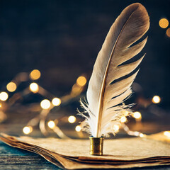 Wall Mural - Antique feather quill on vintage paper with glowing light particles