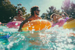  Joyful friends enjoying a summer day floating in a pool with bright orange inner tubes