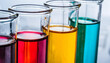 Vibrant Chemistry Experiment with Row of Colorful Liquids in Glass Test Tubes