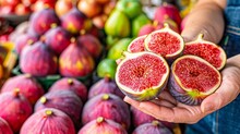 Hand Holding Ripe Fig With Selection On Blurred Background, Ideal For Text Placement