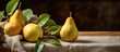 A display of ripe yellow pears with fresh green leaves arranged beautifully on a table, capturing the essence of still life photography