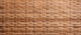 Fototapeta Sypialnia - A detailed closeup of a beige wicker texture, resembling a wooden basket weave pattern. Commonly used as building material for flooring and brickwork
