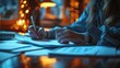 © muji - Professional working at night, lit by warm light