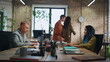 © stockbusters - Office worker flirting colleague throwing paper ball. Managers laughing have fun