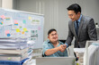 © Kawee - Asian young businessman patient work with manager in office workplace.