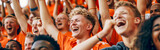 Dutch football soccer fans in a stadium supporting the national team, Oranje 
