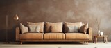 Fototapeta  - A cozy living room with a brown couch against a brown wall, featuring hardwood flooring and artwork in tints and shades of brown