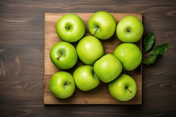 Wall Mural - Green apples on a wooden table. Top view
