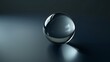 Minimalist crystal ball on smooth surface with dark background and gentle light reflections. Purity and tranquility concept