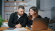 © mahirkart - Young couple sit in the kitchen using laptop pay bills, use calculator count expenses, make budget control, manage finances, review overdue loan payments