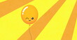 Image of yellow balloon with smile flying on yellow background