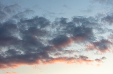 Wall Mural - Beautiful clouds at sunset as a background