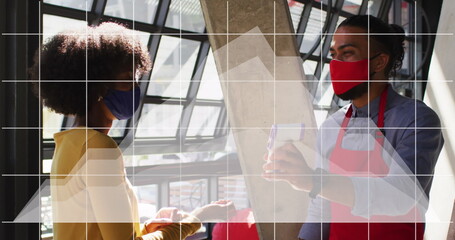 Poster - Image of digital interface and graph over diverse couple in face masks at work using technology