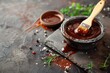 Barbecue sauce on stone table with brush and space for text