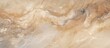 © TheWaterMeloonProjec - A closeup shot of a beige marble texture resembling a painting, with intricate patterns that mimic natural materials like wood or fur