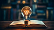 © pickypix - light bulb on the book idea concept