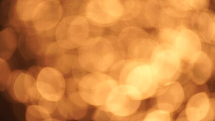 Wall Mural - Abstract Blurred video screensaver bokeh golden sea at sunset. The sun reflects and sparkles on the waves.