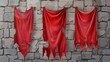 Isolated medieval red cloth banners on stone background. Silk flags with torn edges hanging on old castle wall, blank frame space for royal sign, vertical pennant illustration.