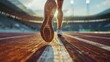 Photo from behind close-up of athlete's feet running around stadium on sunny  day