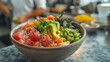 A bowl of poke with various toppings.