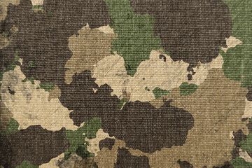 Wall Mural - Texture of military dirty camouflage fabric. Combat protective camouflage for background