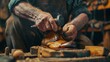 Artisan craftsman hammering on shoe sole in a rustic workshop