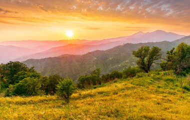 summer scenery mountain view from a highland hill to a beautiful sunset.