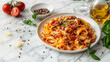 © kazakova0684 - Bolognese noodles on a white plate on a marble background