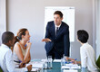 © Tasneem/peopleimages.com - Meeting, presentation and businessman in office with discussion, stats or speaker at b2b workshop. Teamwork, management and business people in conference room brainstorming ideas, planning and review