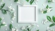 Composition featuring a blank white flat line frame centered on a plain background, elegantly adorned with fresh white jasmine flowers scattered around it.
