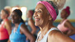 A delighted senior woman in an aerobics class, showcasing the enjoyment of staying active and social