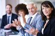 © Mikolette Moller/peopleimages.com - Portrait, woman or applause in business, workshop or meeting of company, corporate or training. Businesswoman, happy clap or team in conference room as professional, presentation or communication