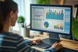 © Iftikhar alam - A woman sitting at a desk in an office while using a computer, A person analyzing statistical data on computer screen, AI Generated