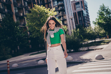 Poster - Photo of beautiful latin mature woman cross road relaxed laughing cheerful smile walking outdoors in urban city outdoors on background