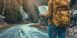 Wanderer mit großem Rucksack hält Landkarte in den Händen und sucht den Weg