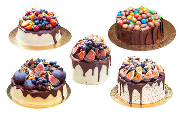 Wall Mural - Delicious cake with figs dipped into melted chocolate, pecan nuts, grapes, chocolate bites and cookies on the top on rustic background