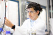 © Connect Images - Scientist engrossed in laboratory research.