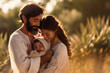 Joseph, Mary and the baby Jesus embrace each other full of joy and love. A sample of the love of the family. The happiness of a couple with a baby. Holy Family full of joy and smiling. Parenthood