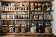 Organized pantry shelves with various grains, seeds, and pasta in labeled jars. Kitchen storage and organization concept. Modern home interior with wooden shelves and food containers